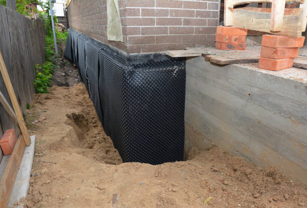 Happy homeowners after waterproofing job in Walton